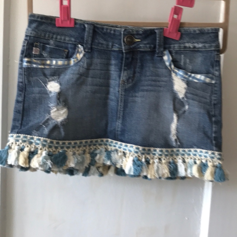 Upcycled Jean skirt. With embellishments